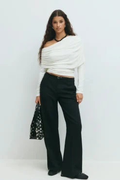 Sloped shoulder cape top