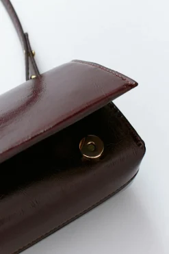 Small patent shoulder bag